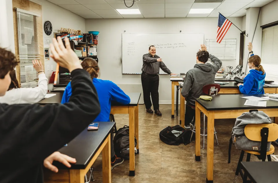 Teacher teaching class of students